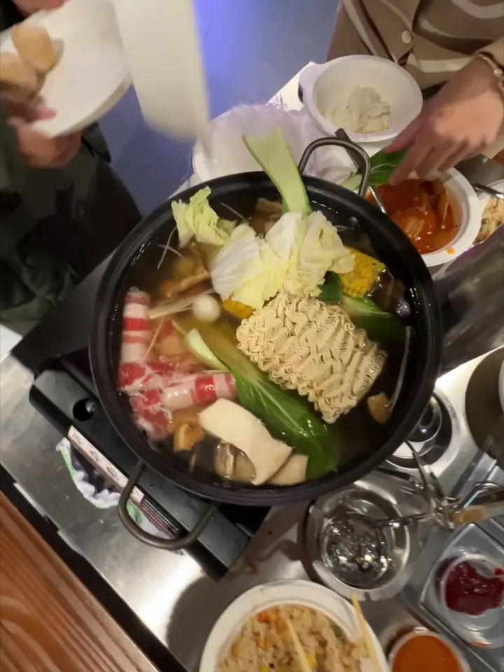 A hot pot full of ingredients simmering at the table at GOGI Geelong