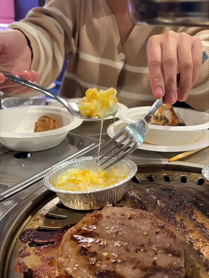 Steak and corn cooking on the grill at GOGI Korean BBQ Buffet Geelong