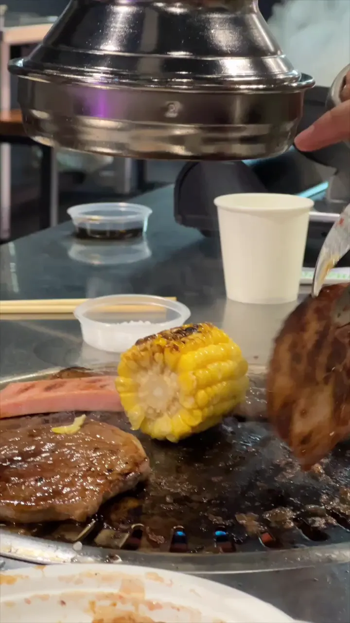 Corn and meat on the grill at GOGI